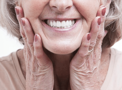 smiling woman with dentures